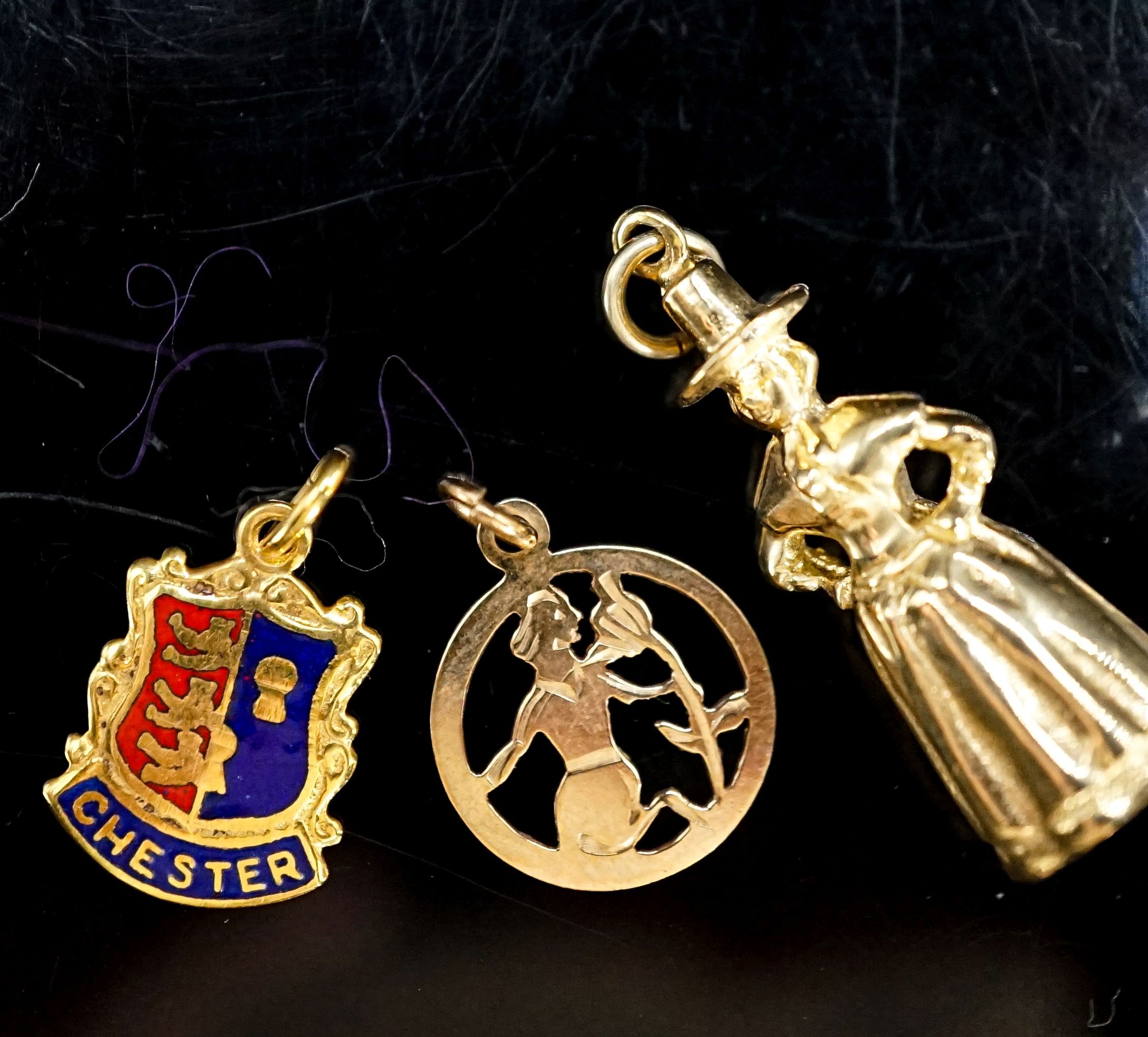 Three assorted 9ct gold charms, including St. Christopher, 6.8 grams.